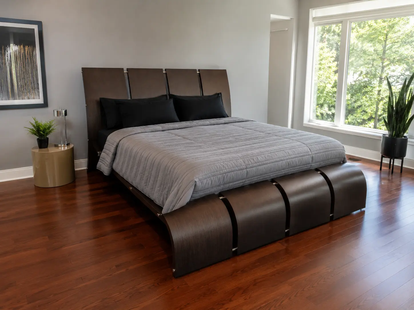 Dark sculptural platform bed in a modern bedroom